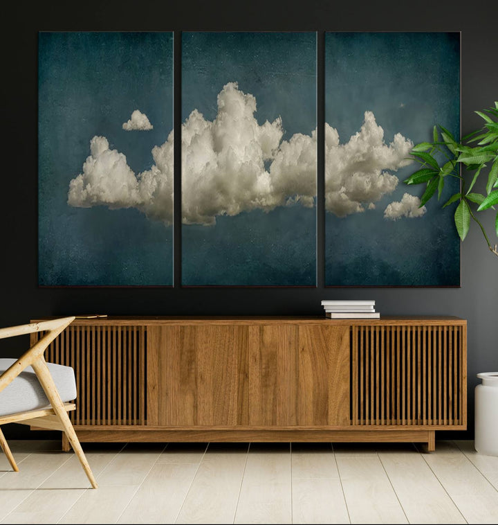 The Vintage Green Clouds Wall Art Canvas Print, set against a teal backdrop, showcases breathtaking canvas artwork with a gallery-quality finish.