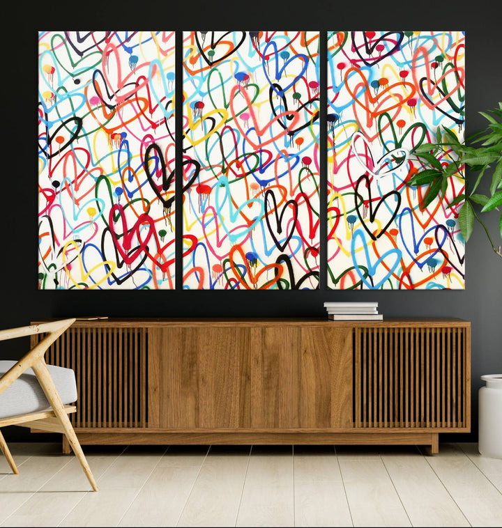 The "Colorful Love Canvas print," featuring vibrant abstract street art with overlapping loops, is handmade in the USA.