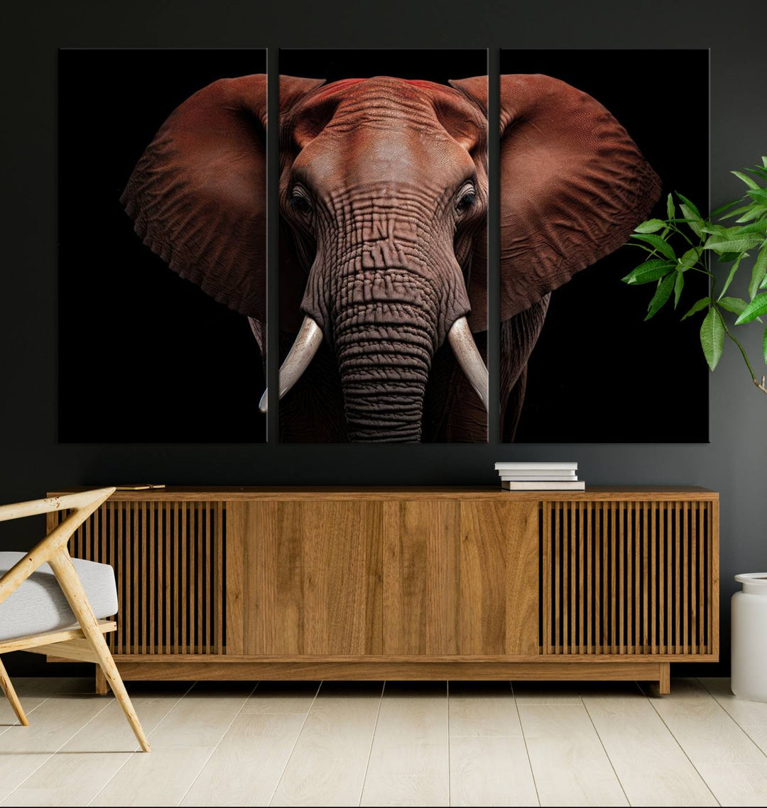 A stunning triptych titled "Wild Elephant Wall Art Canvas Print" beautifully enhances the wall above a contemporary living room. This Africa Savannah Wild Animal Wall Decor Print is of museum-quality, complete with a UV-protective coating to ensure its vibrancy and beauty are preserved for years.