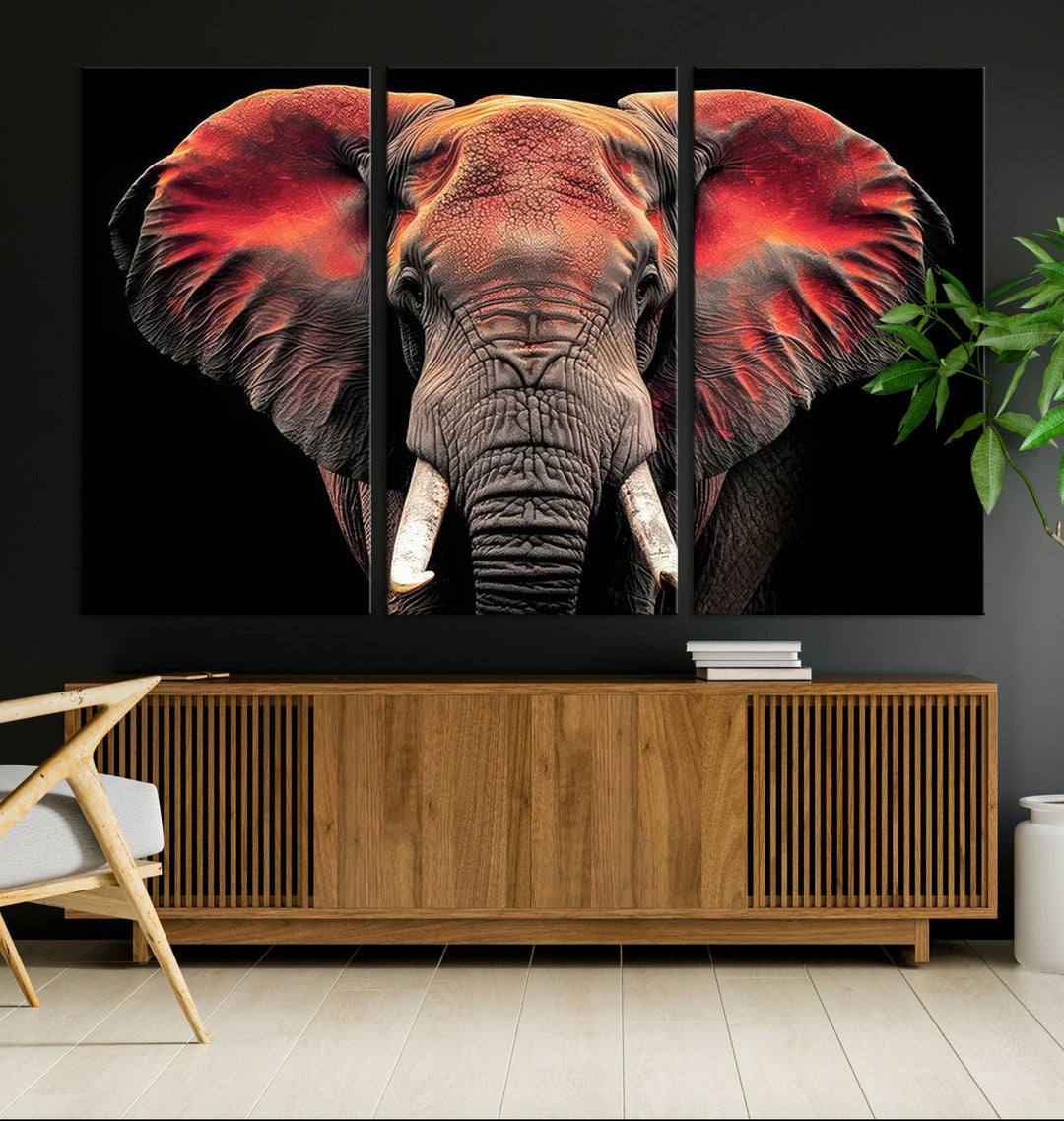 The Elephant Wall Art Canvas Print, featuring vibrant red and black tones, is a stunning artwork printed on museum-quality canvas. It comes with a UV-protective coating.