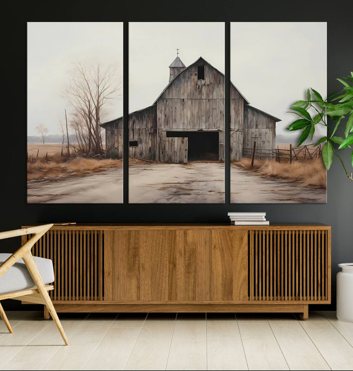 A framed and ready-to-hang Farmhouse Rustic Barn Wall Art Canvas Print is displayed against a gray wall. This stylish modern living room seamlessly combines rural life wall décor with contemporary comfort.