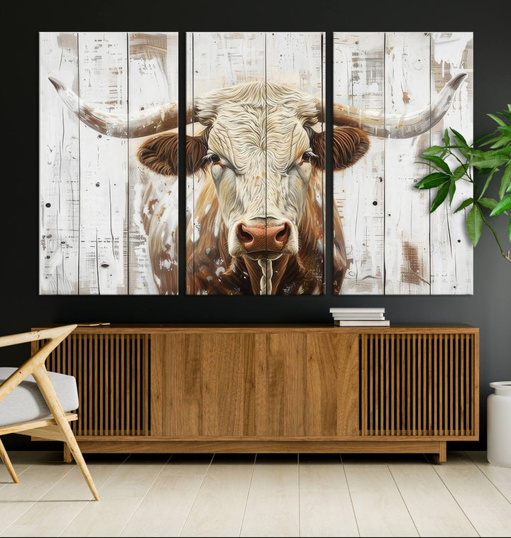 The dimly lit room is enhanced with Western charm by the Rustic Longhorn Bull Wall Art Canvas Set—Western-Inspired Farmhouse Décor, elegantly displayed on the wall.