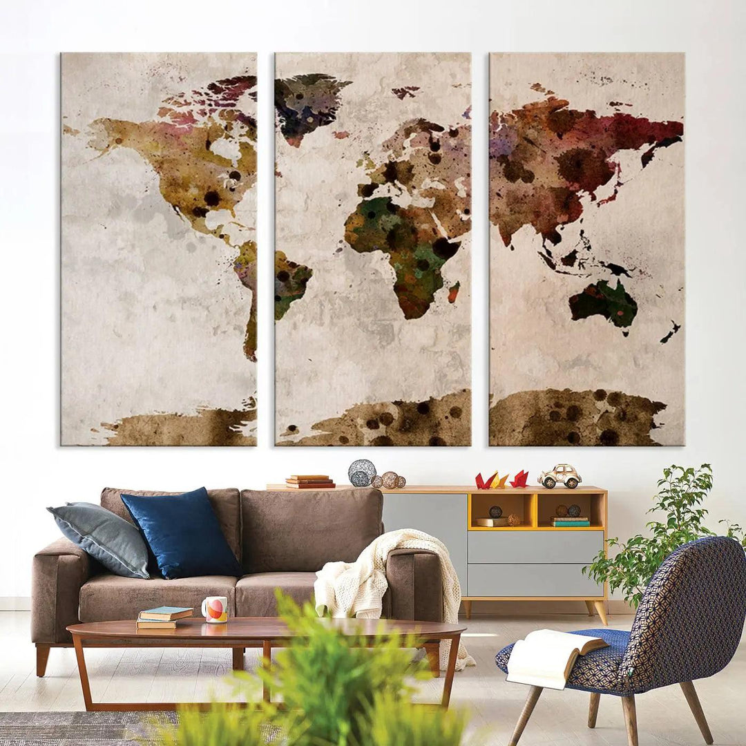 A Watercolor World Map Canvas Print, wrapped in an elegant gallery style, hangs on the wall.