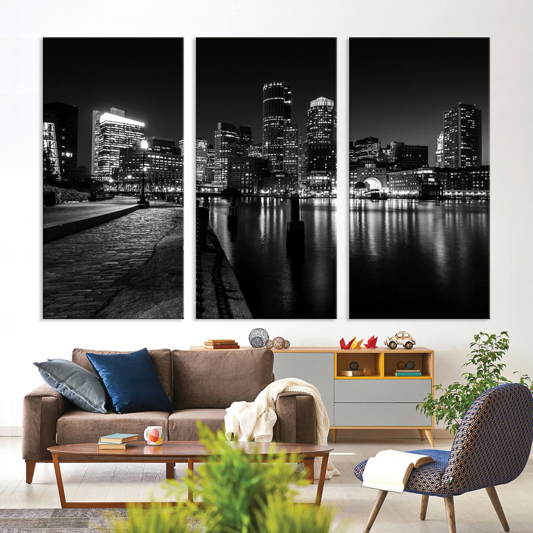 The Boston Lights Skyline Black and White Wall Art Cityscape Canvas Print, crafted with museum-quality canvas and UV-protective coating, serves as a striking triptych centerpiece in the living room.