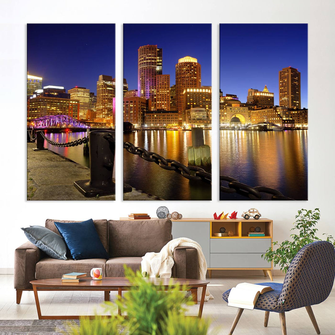 The "Boston City Night Skyline Cityscape View Wall Art Canvas Print" beautifully portrays a stunning triptych of a city skyline illuminated against the night sky, elegantly reflected in the river below. These museum-quality canvases are gallery wrapped to ensure an elegant presentation that enhances any space.