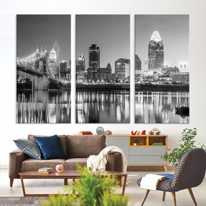 The "Cincinnati City Lights Skyline Black and White Wall Art Cityscape Canvas Print" is elegantly displayed in a stylish living room.