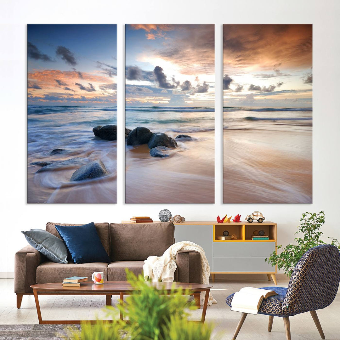 The "Serene Weather On The Beach Wall Art Canvas Print," featuring a tranquil beach scene with rocks and waves, is ready to hang and enjoy.