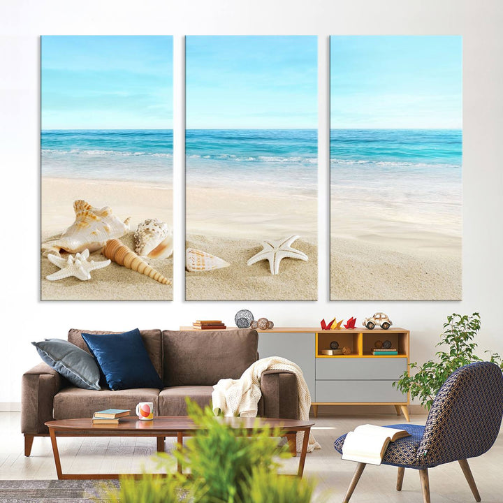 The "Turquoise Ocean View Seashell Starfish on the Beach Canvas Print Artwork" is a triptych piece that showcases a tranquil beach scene, complete with seashells and starfish adorning the sand. It is elegantly gallery-wrapped on museum-quality canvas.