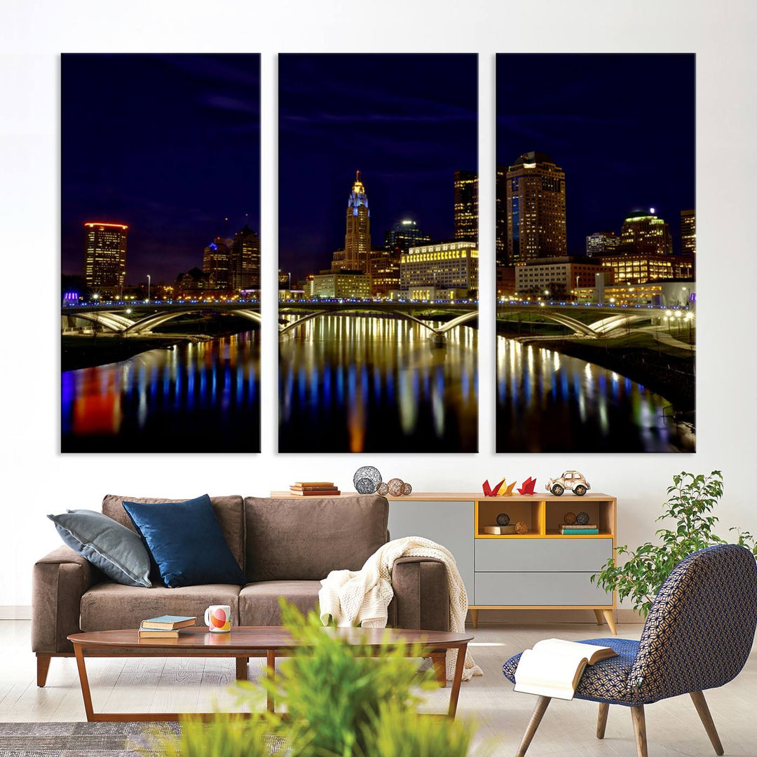 The "Columbus City Lights Night Skyline Cityscape View Wall Art Canvas Print" showcases a stunning city skyline at night, with illuminated buildings and bridges reflecting in the river, on a museum-quality canvas ready to hang.