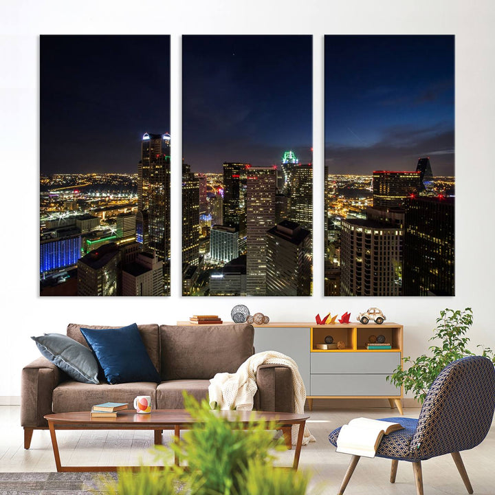 A living room showcasing a Dallas City Lights Night Skyline Cityscape View Wall Art Canvas Print, a three-panel artwork on museum-quality canvas with vibrant colors and durability.