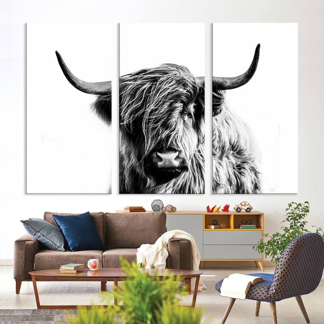 The Scottish Highland Cow Cattle Art Print Farmhouse Wall Art Canvas Print enhances rustic farmhouse decor with its depiction of a long-haired, large-horned cow. This triptych is an ideal choice for chic wall art.