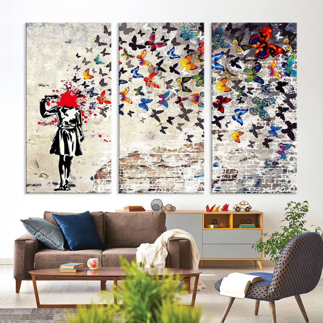 The Banksy Art Butterfly Girl Explosion Canvas showcases a dynamic figure with butterflies bursting from their head, set against a textured wall background. This vibrant urban graffiti piece is perfect for modern interiors and comes ready to hang.