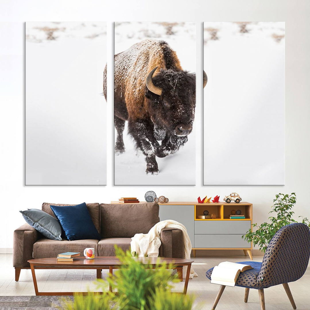 The Bison Winter Wall Art Canvas Print for Farmhouse Decor is displayed as a triptych in the living room. This artwork, printed on museum-quality canvases with a UV-protective coating to maintain its vibrant colors, is the focal point of the space.