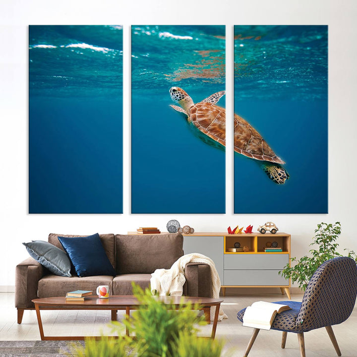 The living room features the "Baby Turtle in Ocean" wall art canvas print. This gallery-quality piece, depicting a sea turtle swimming underwater, adds an elegant touch to the space.