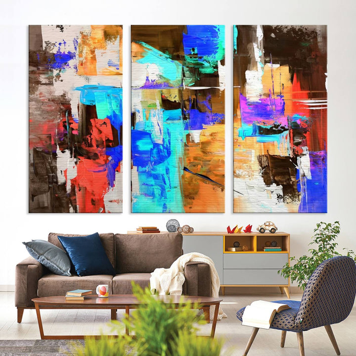 In a modern living room, the "Colorful Abstract Wall Art Canvas Print" serves as a stunning triptych centerpiece on museum-quality canvas, ready to hang. Its UV-protective coating ensures enduring vibrancy.