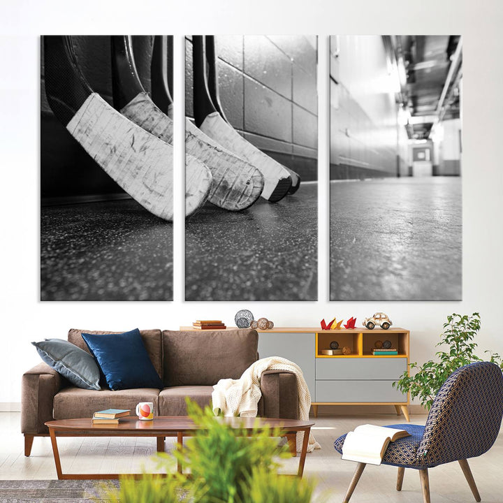 A living room featuring a large Ice Hockey Wall Art Canvas Print on gallery-wrapped canvas.