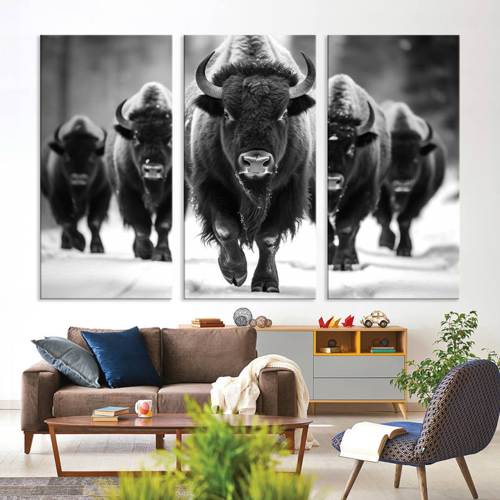 A modern living room features a striking black-and-white American Bison Art | Buffalo Herd Wall Art Canvas Print on the wall.