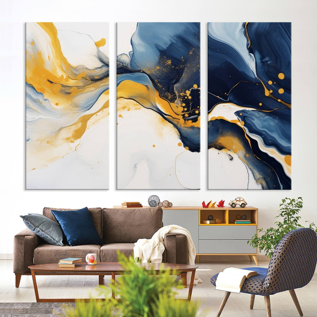 The Blue and Gold Abstract Fluid Canvas Art, with its swirling patterns, adorns the wall. This modern wall art beautifully complements the contemporary interior decor, adding an elegant touch with its rich blue, gold, and white tones.