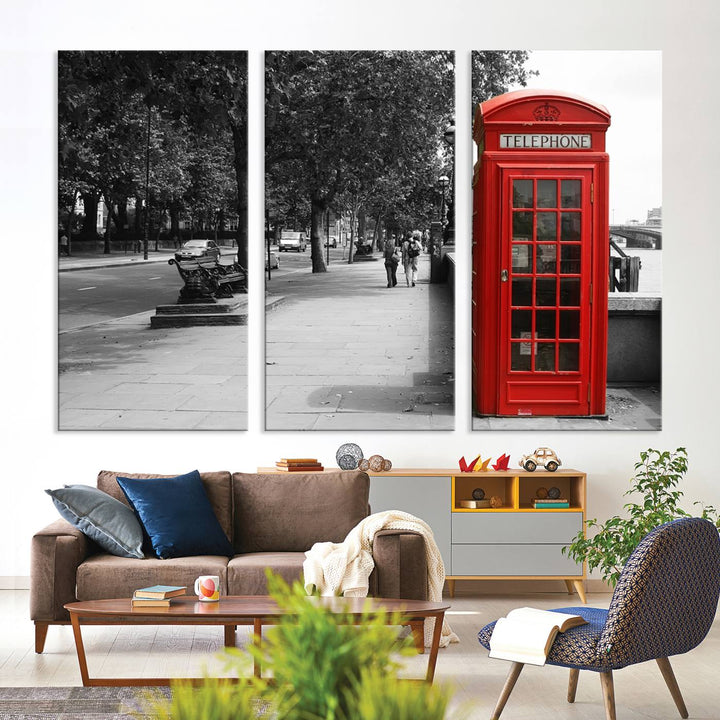 The London Phone Club Wall Art is a stunning piece that showcases a red telephone box set in a black and white street scene on museum-quality canvas. It is gallery wrapped with a UV-protective coating to preserve its vibrant charm.