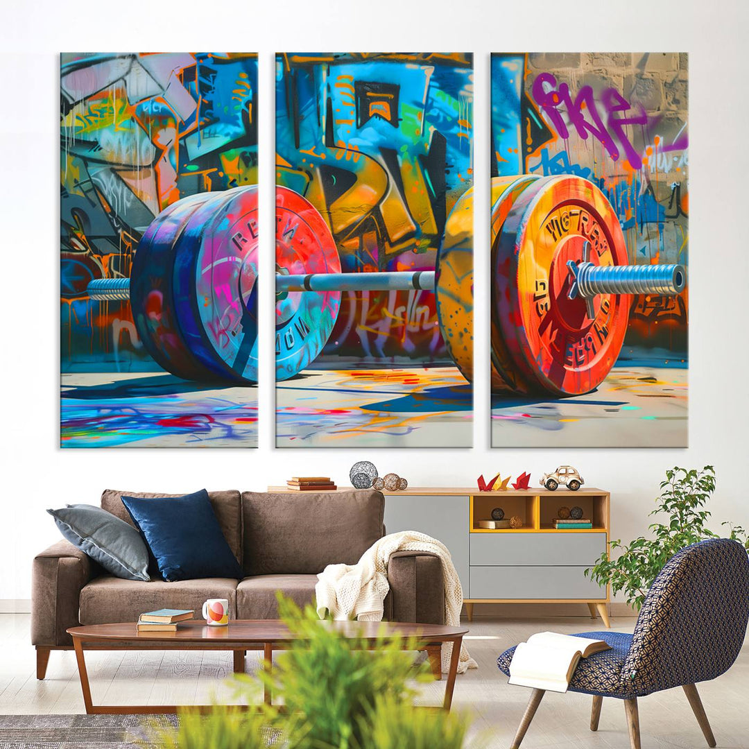 The Fitness Gym Barbell Graffiti Wall Art Canvas Print, a vibrant triptych featuring a barbell against a graffiti backdrop, elegantly hangs in the room. Crafted on premium canvas with a gallery-quality finish, this stunning piece of wall art effortlessly combines urban flair with sophisticated decor.