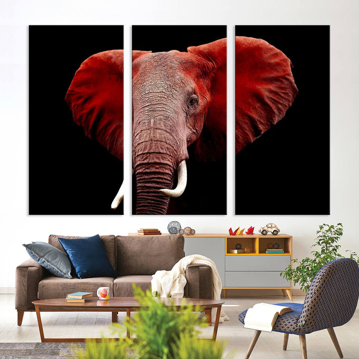 A Wall Art Canvas Print in the modern living room features a three-panel premium design of a red elephant face.