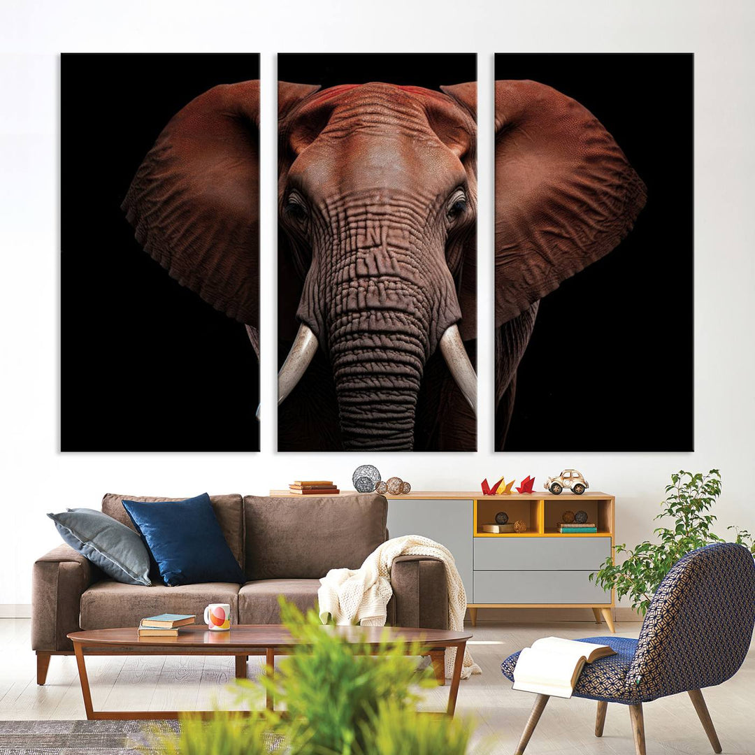 A stunning triptych titled "Wild Elephant Wall Art Canvas Print" beautifully enhances the wall above a contemporary living room. This Africa Savannah Wild Animal Wall Decor Print is of museum-quality, complete with a UV-protective coating to ensure its vibrancy and beauty are preserved for years.