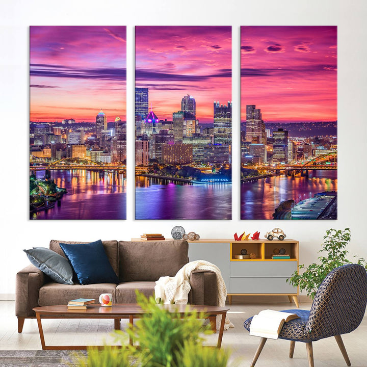 The Pittsburg Wall Art Canvas Print, showcasing a vibrant sunset glow over the city skyline and crafted by a professional artisan, adorns the space.