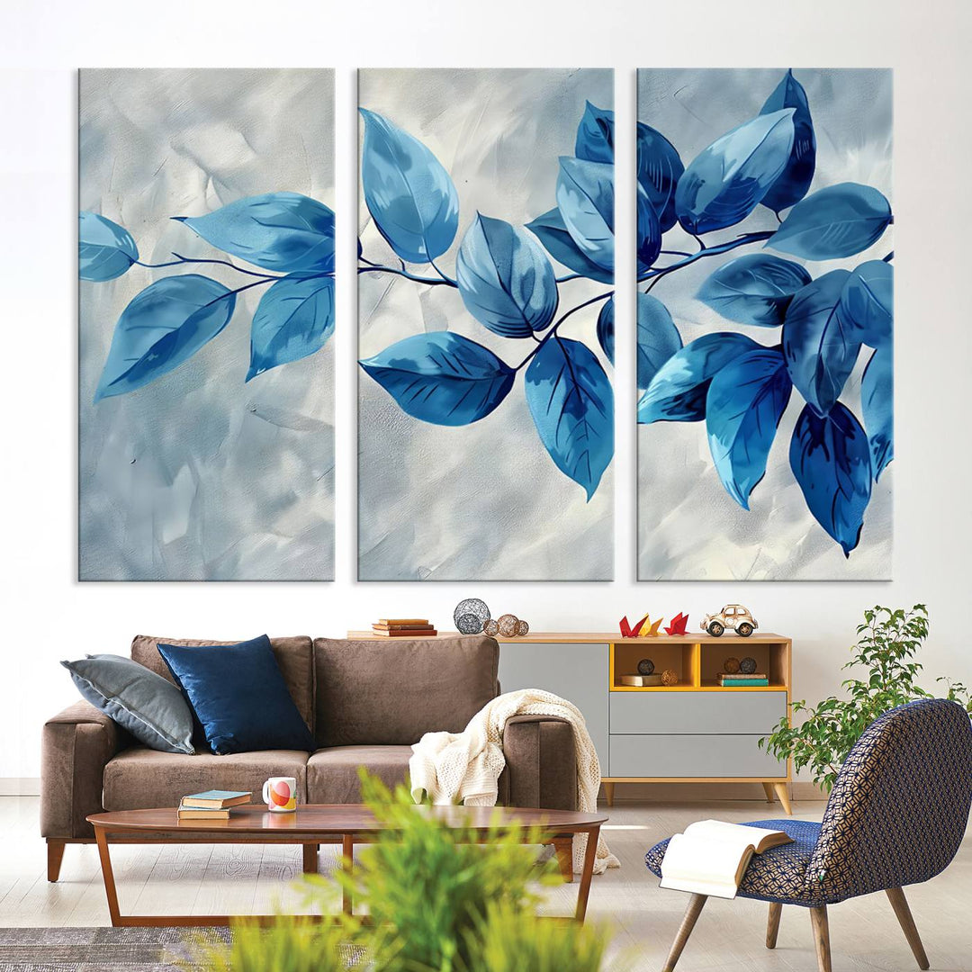 A Blue Leaf Abstract Wall Art Canvas Print, featuring a textured background and gallery-quality finish, is displayed.