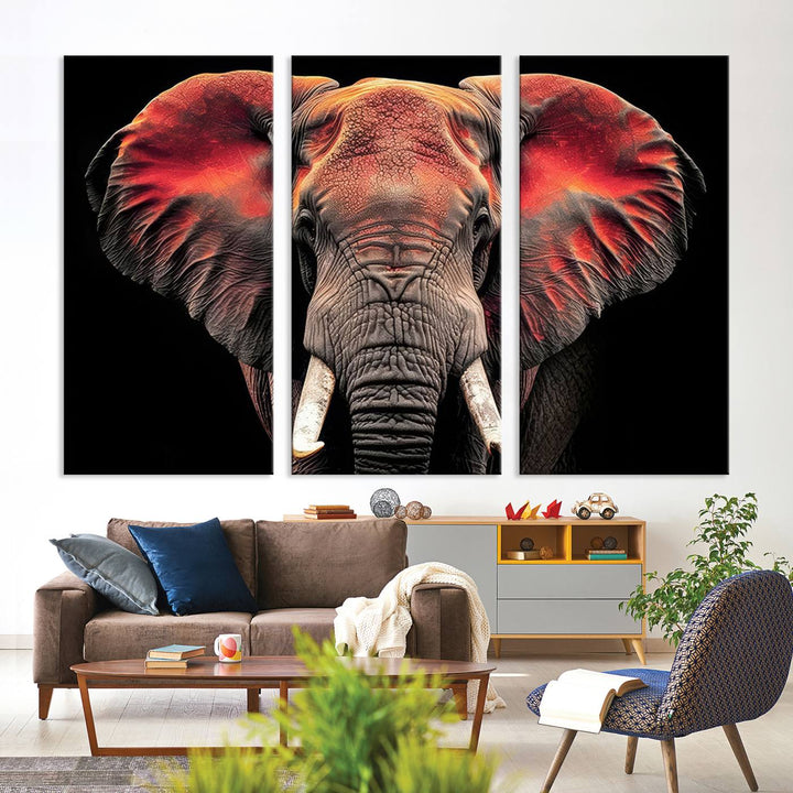 The Elephant Wall Art Canvas Print, featuring vibrant red and black tones, is a stunning artwork printed on museum-quality canvas. It comes with a UV-protective coating.