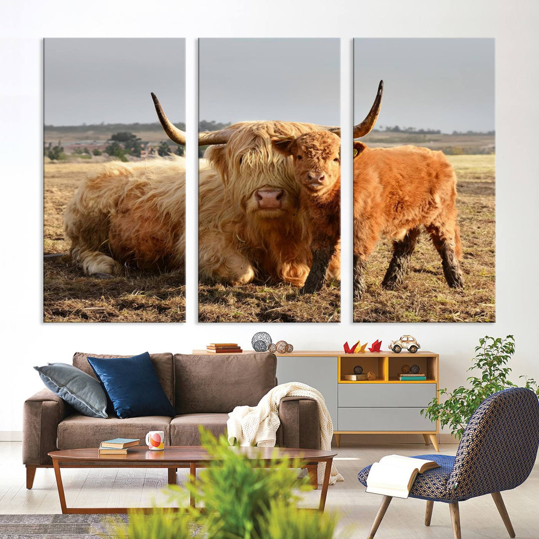 The three-panel canvas artwork, titled "Highland Cow Canvas Wall Art Animal Print for Farm House Decor," features a serene scene of a resting Highland cow and calf in a field. The piece highlights its gallery-quality finish.