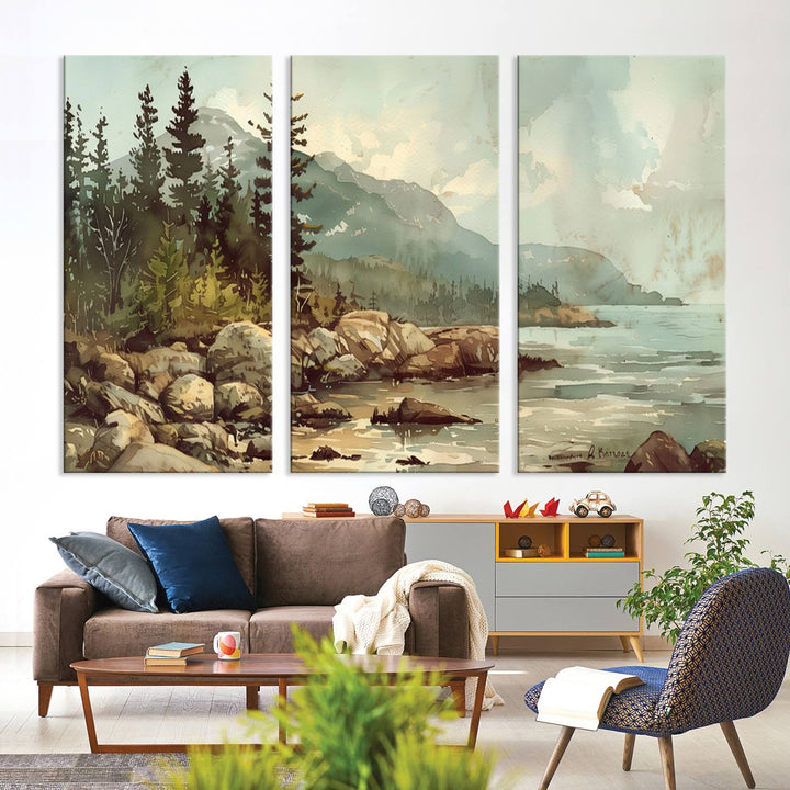 The living room features a breathtaking three-panel Abstract Acadia National Park Wall Art Canvas Print, which beautifully captures the rocky Maine coastline with trees and mountains.