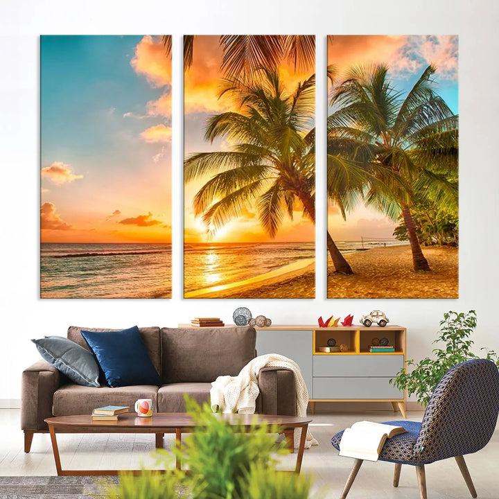 The Tropical Sunset Wall Art Print features a vibrant beach scene with palm trees and an ocean view highlighted by a golden sunset.