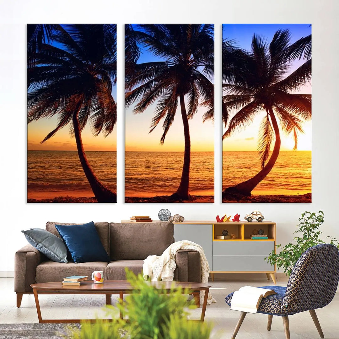 The living room features a wall adorned with the "Wall Art Canvas Curve Palms at Sunset on Beach," showcasing gallery-wrapped, museum-quality canvases in a stunning triptych.