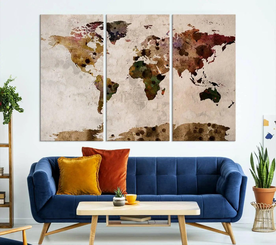 A Watercolor World Map Canvas Print, wrapped in an elegant gallery style, hangs on the wall.