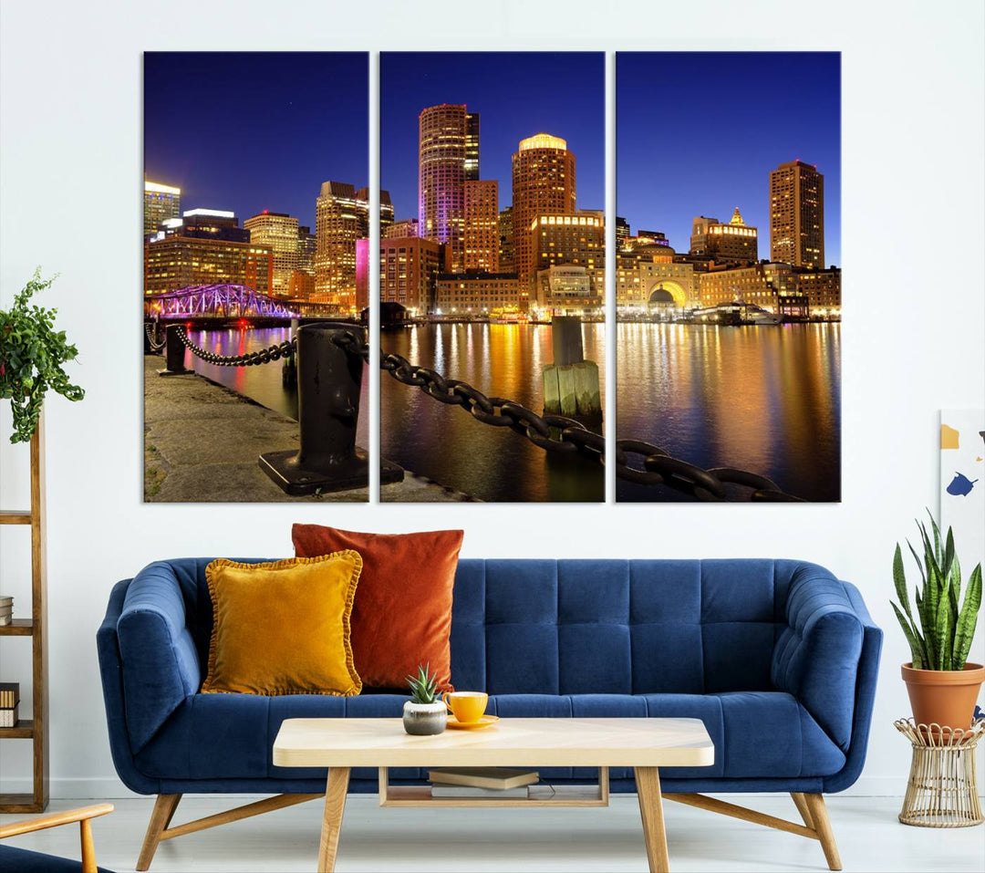 The "Boston City Night Skyline Cityscape View Wall Art Canvas Print" beautifully portrays a stunning triptych of a city skyline illuminated against the night sky, elegantly reflected in the river below. These museum-quality canvases are gallery wrapped to ensure an elegant presentation that enhances any space.