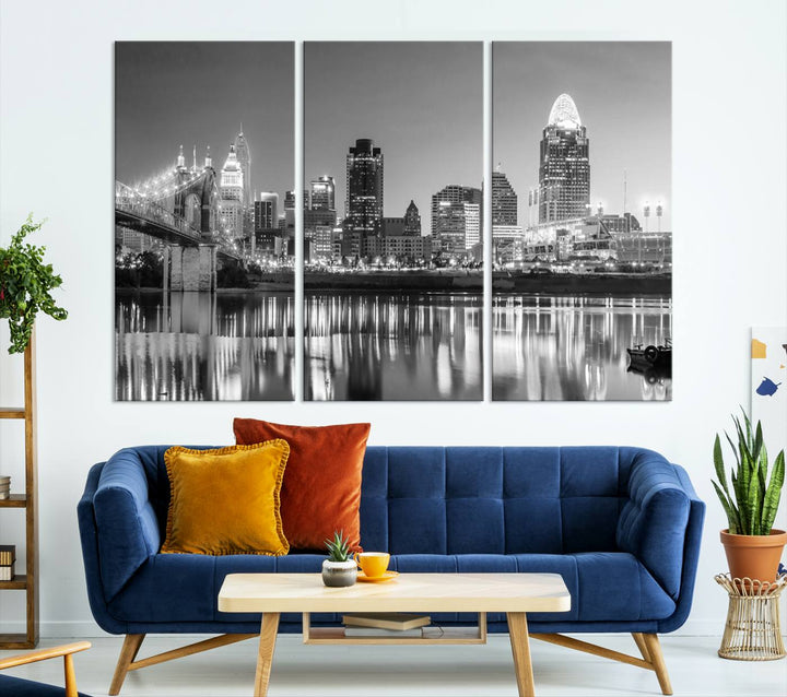 The "Cincinnati City Lights Skyline Black and White Wall Art Cityscape Canvas Print" is elegantly displayed in a stylish living room.