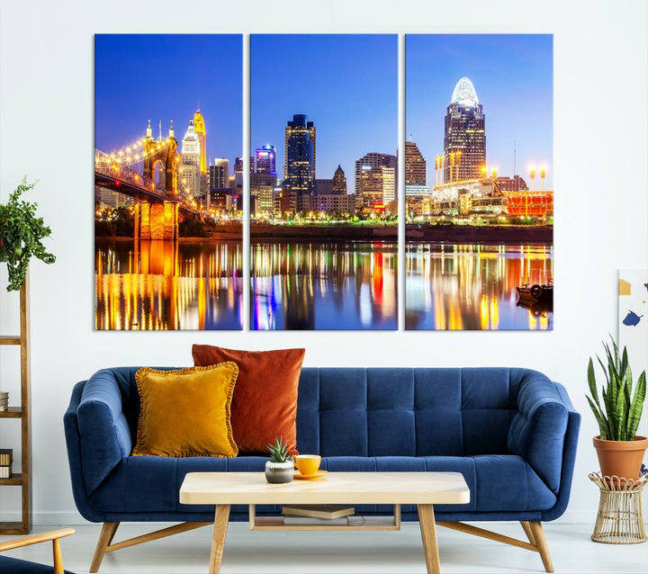 The "Cincinnati City Lights Night Skyline Cityscape View Wall Art Canvas Print" is a gallery-wrapped, museum-quality canvas illustrating a lit-up bridge and skyline at night. Enhanced with a UV-protective coating, this piece ensures lasting vibrancy.