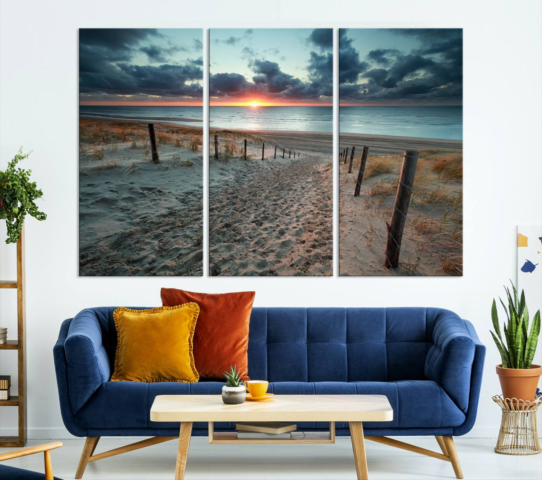 The modern living room features the Cloudy Weather Sunset Beach Wall Art Canvas Print. This museum-quality canvas adds a touch of sophistication with its hand-assembled framed art, ensuring lasting elegance. Enjoy free shipping on this exquisite piece.