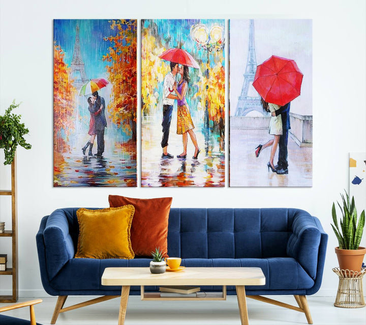 A triptych of the "Love in Paris Wall Art Canvas Print" showcases a couple with an umbrella in romantic settings. This artwork is crafted on museum-quality canvas and features a UV-protective coating for peace of mind. It also comes with the added convenience of free shipping.