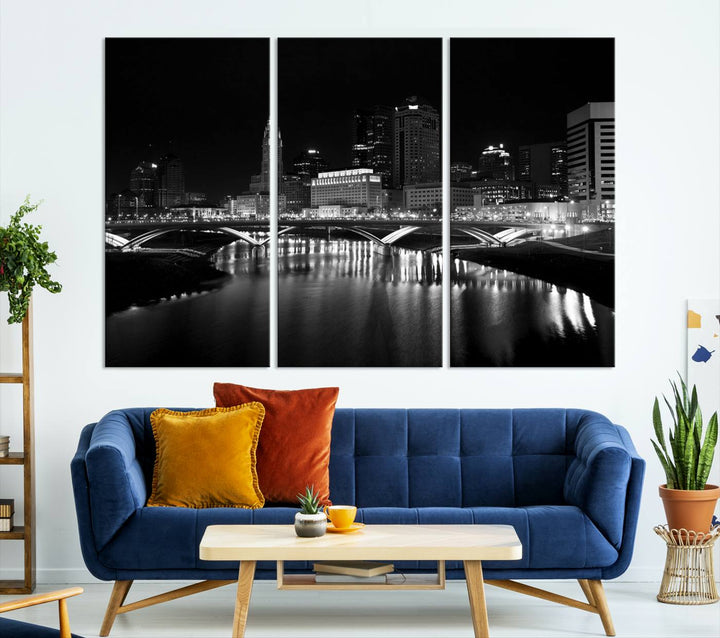 The living room features the "Columbus City Lights Skyline Black and White Wall Art Cityscape Canvas Print" above a coffee table. This artwork is presented as a triptych on museum-quality canvases with UV-protective coating.