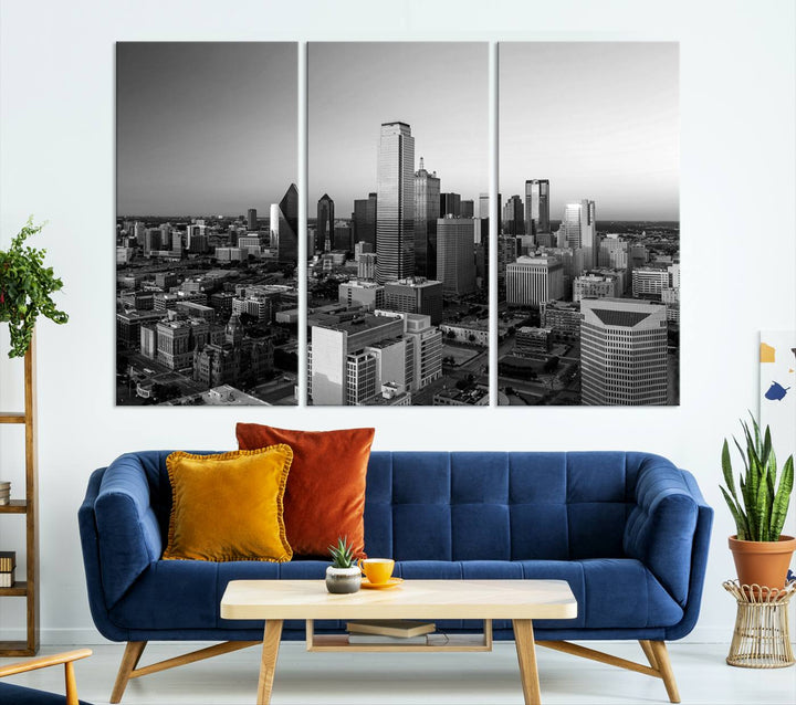 A modern living room showcases the Dallas City Lights Skyline Black and White Wall Art Cityscape Canvas Print. This gallery-wrapped piece offers a sleek finish and is crafted from museum-quality pollycotton. It features a UV-protective coating to ensure lasting vibrancy.