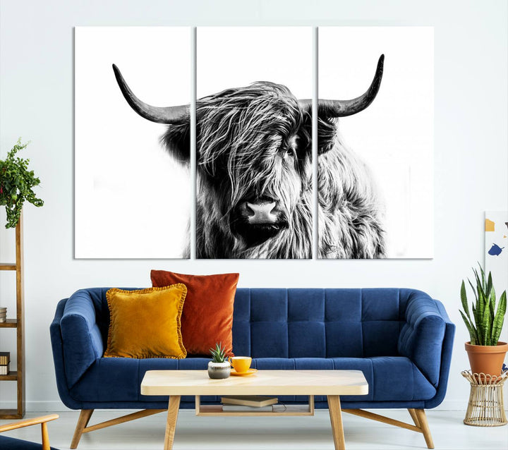 The Scottish Highland Cow Cattle Art Print Farmhouse Wall Art Canvas Print enhances rustic farmhouse decor with its depiction of a long-haired, large-horned cow. This triptych is an ideal choice for chic wall art.