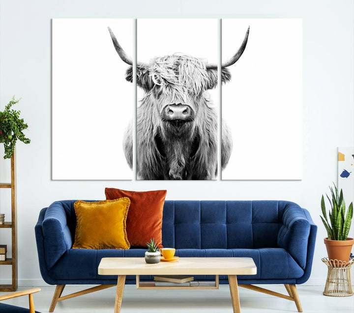 The wall art features a triptych of a Scottish Highland cow, printed on museum-quality canvases with a UV-protective coating. This decorative piece is known as the Highland Cow Canvas Wall Art Farm House Wall Art.