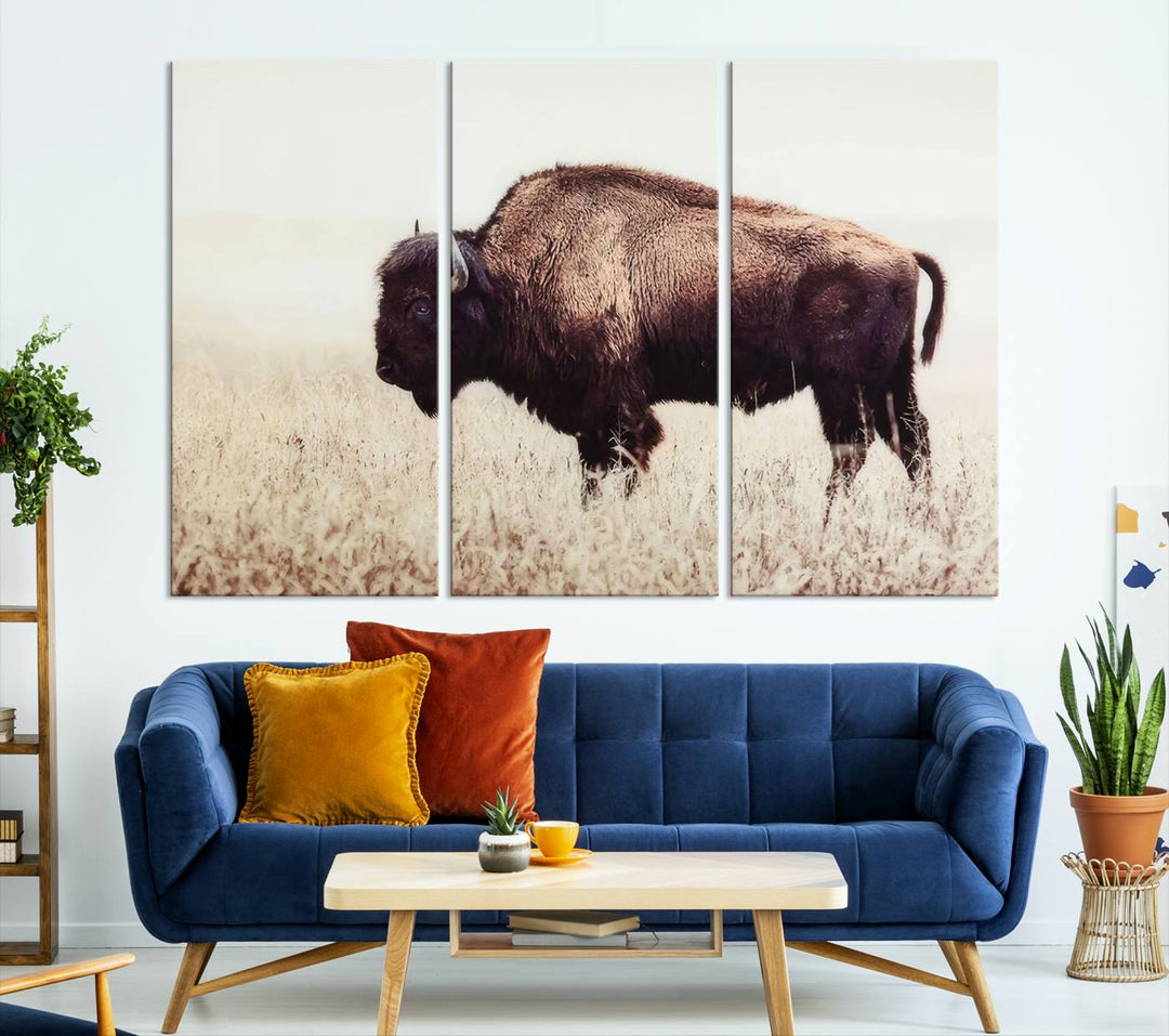 A stylish living room showcases the captivating "Bison in Field" Wall Art Canvas Print as farmhouse decor.