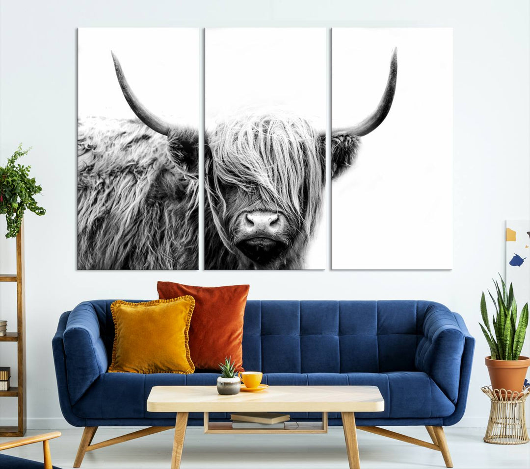 A museum-quality triptych titled "Black White Scottish Highland Cow Cattle Art Print Farmhouse Wall Art Canvas Print" embellishes the dark wall. The canvas is equipped with a UV-protective coating to ensure lasting vibrancy.