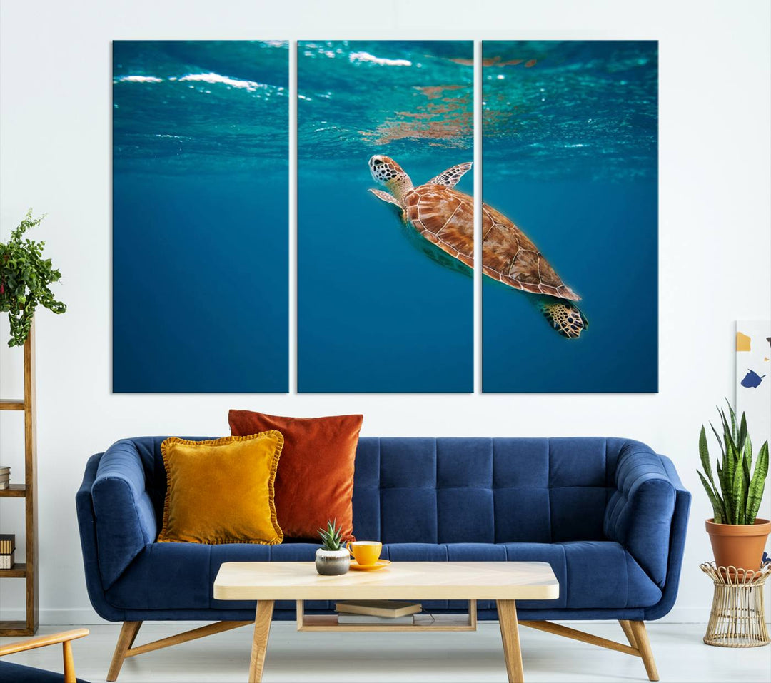 The living room features the "Baby Turtle in Ocean" wall art canvas print. This gallery-quality piece, depicting a sea turtle swimming underwater, adds an elegant touch to the space.