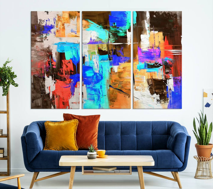 In a modern living room, the "Colorful Abstract Wall Art Canvas Print" serves as a stunning triptych centerpiece on museum-quality canvas, ready to hang. Its UV-protective coating ensures enduring vibrancy.