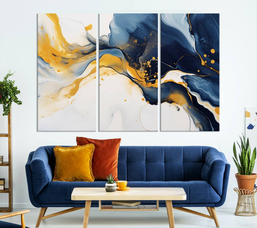 The Blue and Gold Abstract Fluid Canvas Art, with its swirling patterns, adorns the wall. This modern wall art beautifully complements the contemporary interior decor, adding an elegant touch with its rich blue, gold, and white tones.