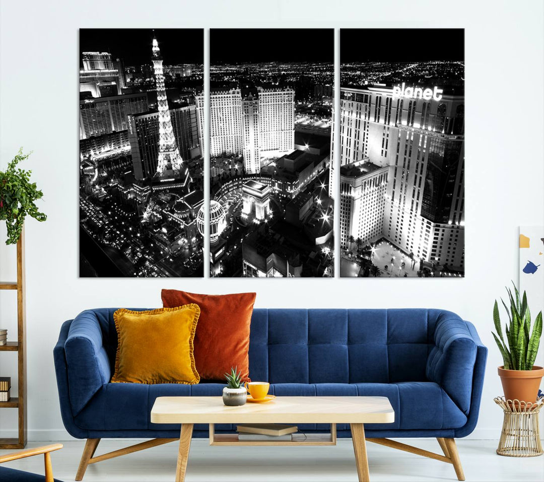 The Las Vegas Wall Art Canvas Print is a black and white triptych that showcases a city skyline at night. Crafted on museum-quality canvas with a UV-protective coating, it serves as an elegant and ready-to-hang focal point in the room.