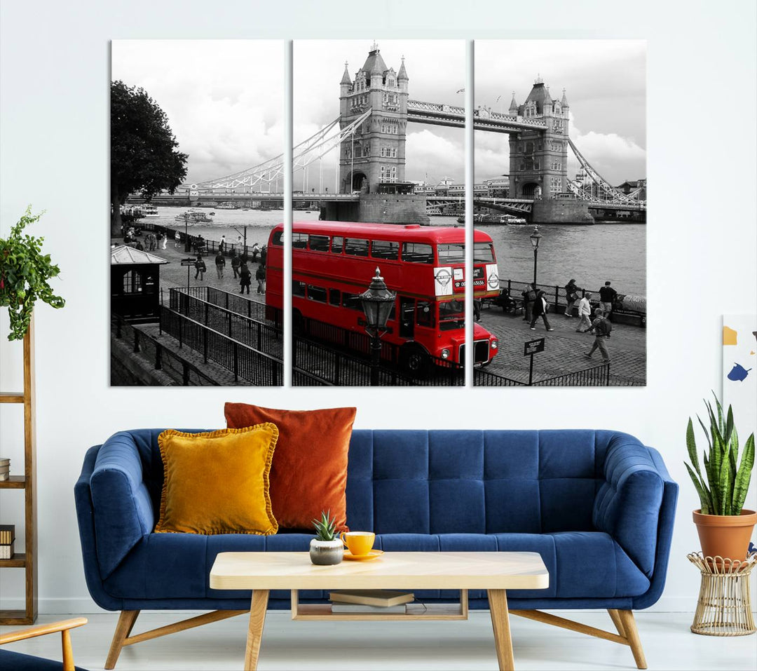 The London Red Bus and Bridge Wall Art Canvas Print showcases a red London bus in front of Tower Bridge, beautifully presented as a gallery-wrapped canvas. This striking image is divided into three panels, delivering a museum-quality display that's ready to hang.